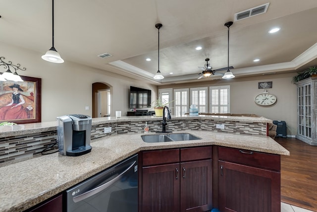 7302 Giotto St, Odessa, TX 79765 - kitchen with stainless steel dishwasher, a sink, open floor plan, a tray ceiling, and crown molding