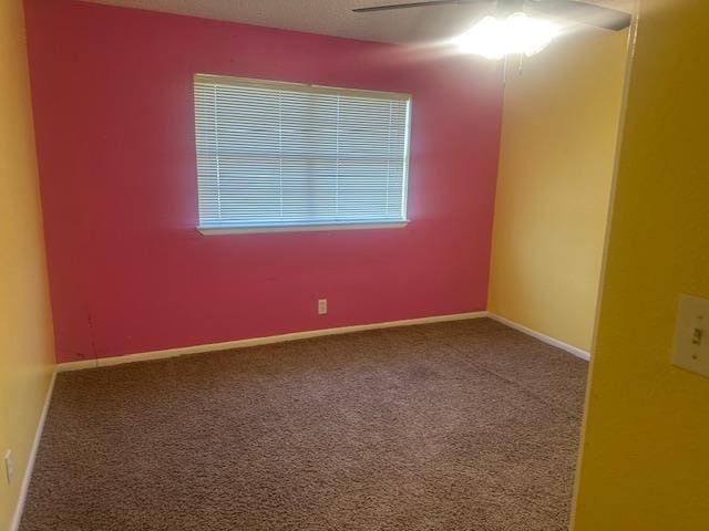 606 NW 14th St, Andrews, TX 79714 - carpeted empty room featuring a ceiling fan and baseboards