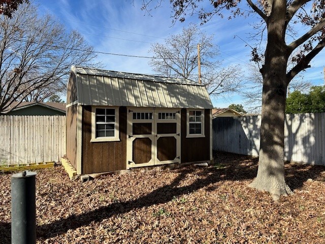 1203 S Nelson Ave, Monahans, TX 79756 - view of shed featuring a fenced backyard