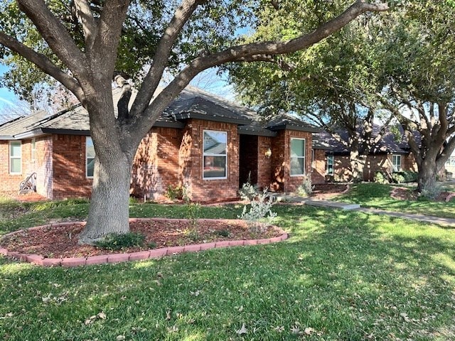 1203 S Nelson Ave, Monahans, TX 79756 - single story home featuring brick siding and a front yard