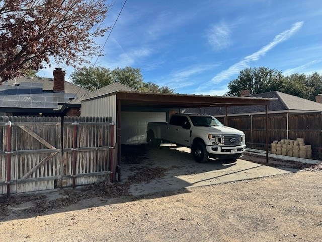 1203 S Nelson Ave, Monahans, TX 79756 - view of parking / parking lot featuring fence and driveway