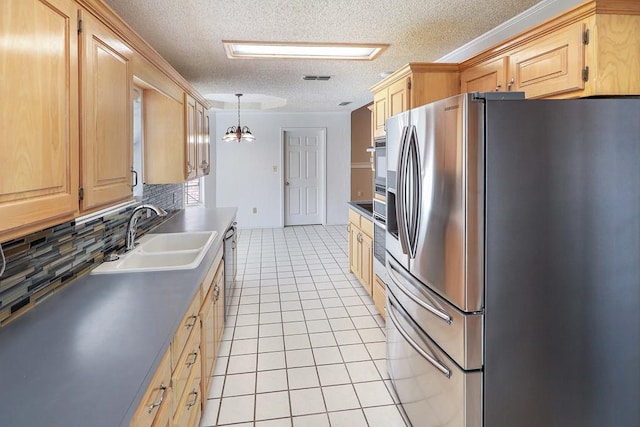 1203 S Nelson Ave, Monahans, TX 79756 - kitchen with stainless steel refrigerator with ice dispenser, a sink, light brown cabinets, light tile patterned floors, and tasteful backsplash