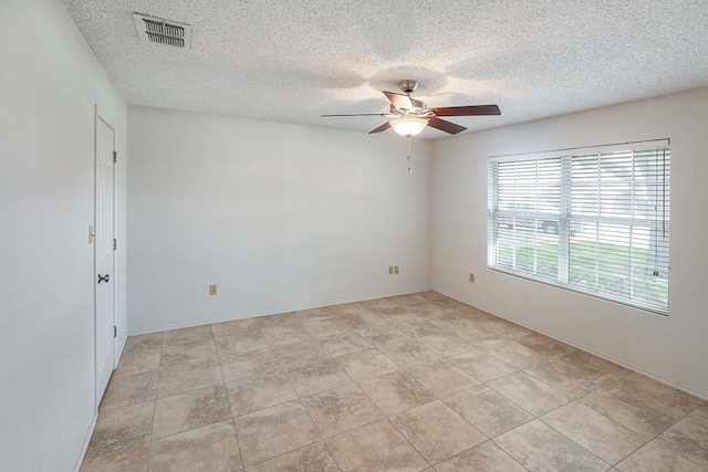 1203 S Nelson Ave, Monahans, TX 79756 - unfurnished room featuring a ceiling fan and a textured ceiling