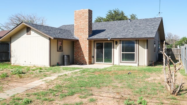 4603 N Tom Green Ave, Odessa, TX 79762 - back of house with a chimney and roof with shingles