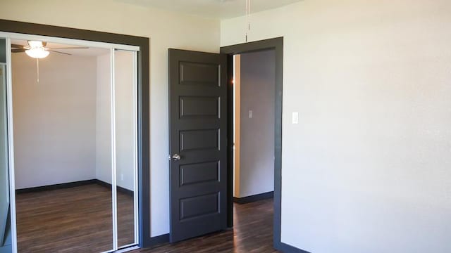 4603 N Tom Green Ave, Odessa, TX 79762 - unfurnished bedroom featuring dark wood-type flooring and a closet