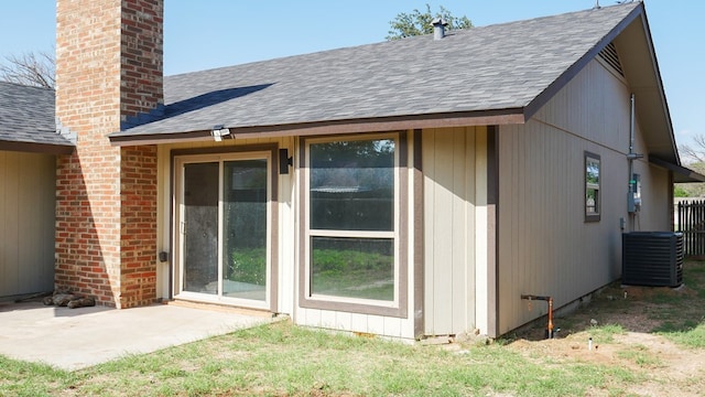 4603 N Tom Green Ave, Odessa, TX 79762 - back of property featuring a shingled roof and a chimney