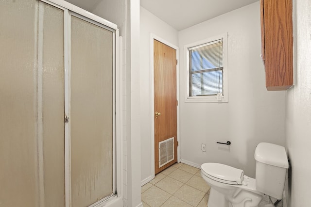 4530 W Morris St, Odessa, TX 79764 - full bathroom with toilet, a stall shower, tile patterned flooring, and baseboards
