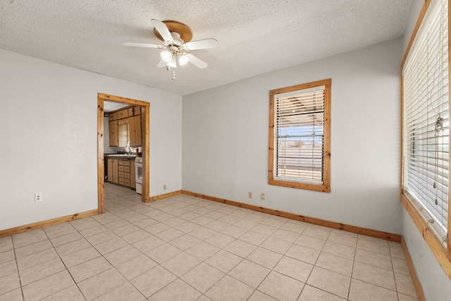 4530 W Morris St, Odessa, TX 79764 - unfurnished room featuring ceiling fan, a textured ceiling, and baseboards