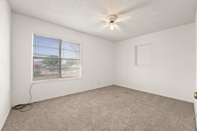 4530 W Morris St, Odessa, TX 79764 - spare room featuring carpet flooring, ceiling fan, a textured ceiling, and baseboards
