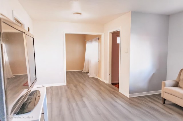 3703 N Jackson Ave, Odessa, TX 79762 - corridor featuring light wood-style flooring and baseboards