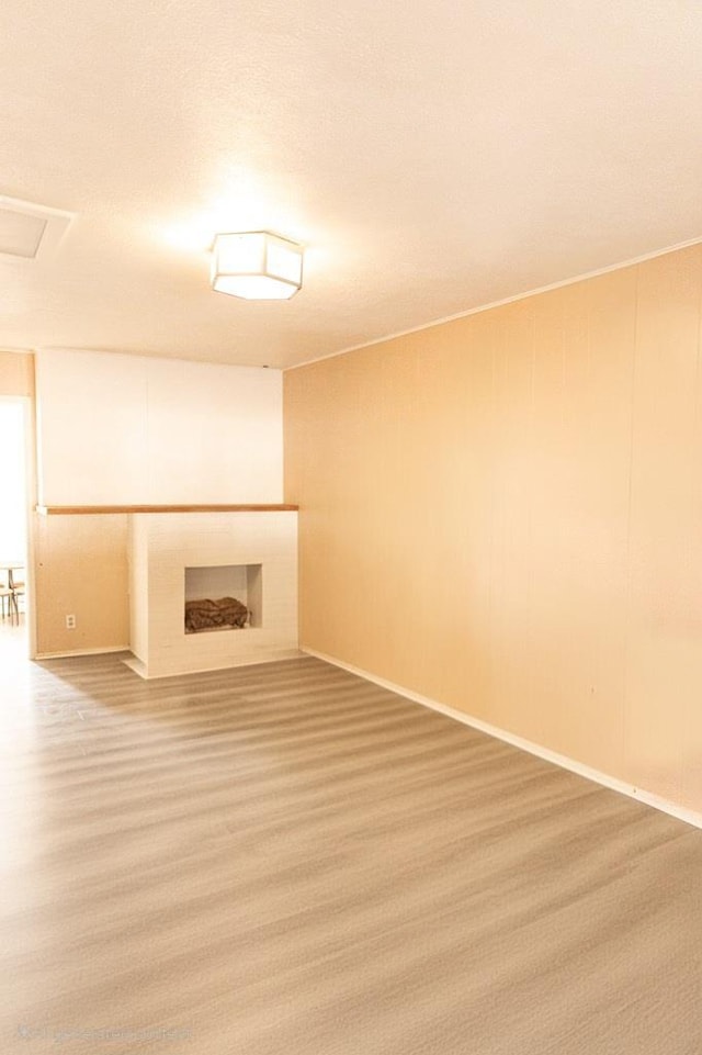 3703 N Jackson Ave, Odessa, TX 79762 - unfurnished living room featuring a fireplace with flush hearth and baseboards