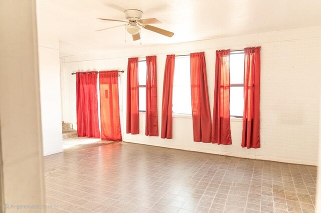 3703 N Jackson Ave, Odessa, TX 79762 - spare room with ceiling fan and brick wall