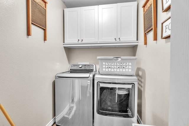 1000 S Nelson Rd, Monahans, TX 79756 - washroom with cabinet space and separate washer and dryer