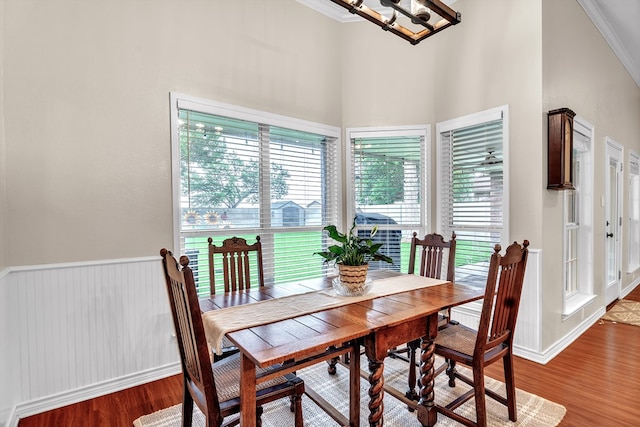 1000 S Nelson Rd, Monahans, TX 79756 - dining area featuring crown molding, wood finished floors, a chandelier, and a high ceiling