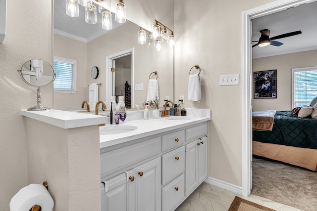 1000 S Nelson Rd, Monahans, TX 79756 - full bath featuring ensuite bathroom, ornamental molding, a ceiling fan, and double vanity