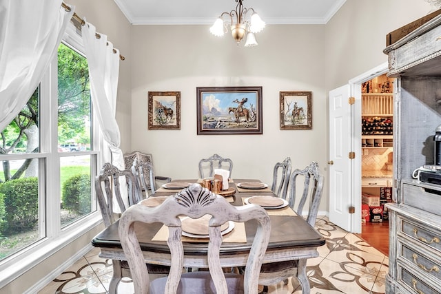 1000 S Nelson Rd, Monahans, TX 79756 - dining room with a chandelier, ornamental molding, and light tile patterned floors