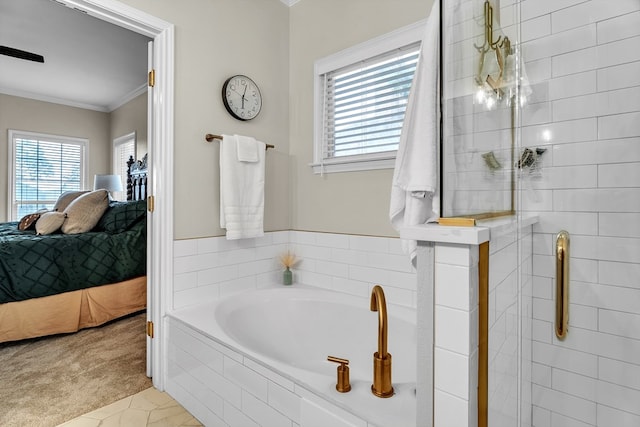 1000 S Nelson Rd, Monahans, TX 79756 - ensuite bathroom with ornamental molding, a garden tub, plenty of natural light, and a stall shower
