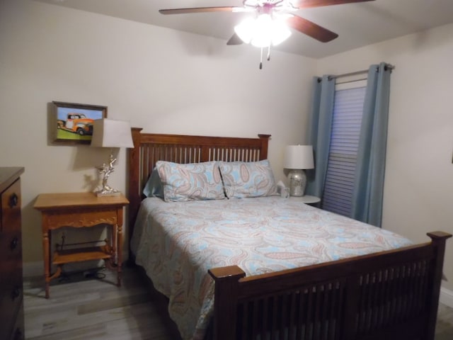 bedroom featuring ceiling fan and wood-type flooring