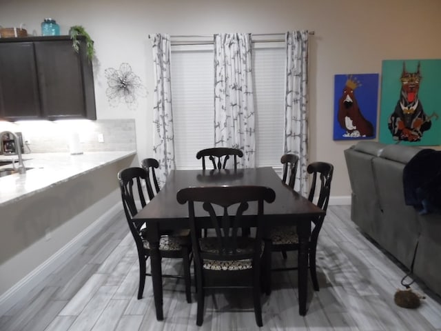 dining area with light wood-type flooring