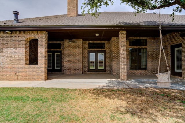 259 County Rd 304, Seminole, TX 79360 - rear view of property with french doors, brick siding, a patio, and a shingled roof