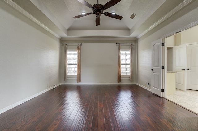 259 County Rd 304, Seminole, TX 79360 - unfurnished room featuring a ceiling fan, a tray ceiling, baseboards, wood finished floors, and crown molding