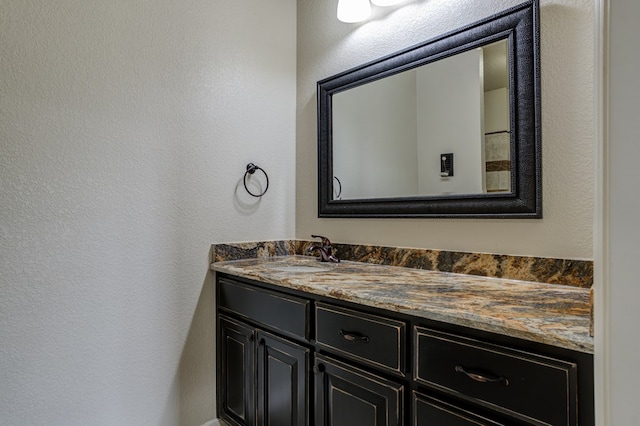 259 County Rd 304, Seminole, TX 79360 - bathroom with a textured wall and vanity