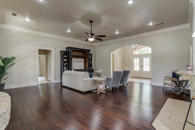 259 County Rd 304, Seminole, TX 79360 - living room featuring arched walkways, hardwood / wood-style floors, ornamental molding, french doors, and a ceiling fan