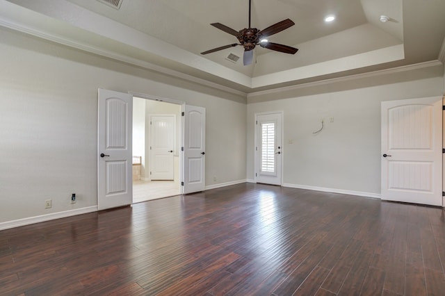 259 County Rd 304, Seminole, TX 79360 - unfurnished room with a ceiling fan, baseboards, dark wood-style floors, a raised ceiling, and recessed lighting