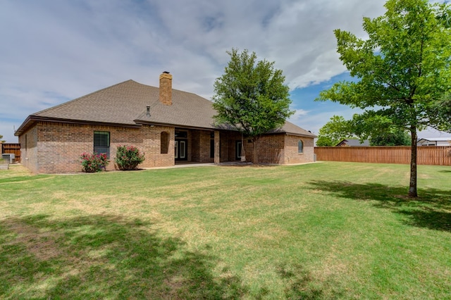 259 County Rd 304, Seminole, TX 79360 - back of house with a chimney, brick siding, and a shingled roof
