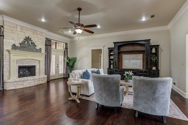 259 County Rd 304, Seminole, TX 79360 - living area with crown molding, a ceiling fan, dark wood-style flooring, a fireplace, and baseboards