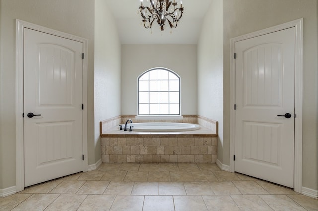259 County Rd 304, Seminole, TX 79360 - bathroom featuring a bath, a chandelier, and tile patterned floors