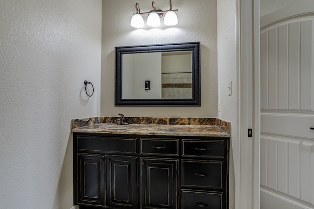 259 County Rd 304, Seminole, TX 79360 - bathroom with vanity and a textured wall