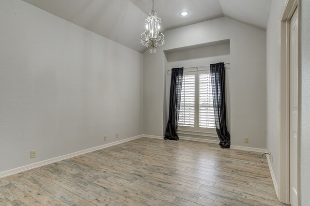 259 County Rd 304, Seminole, TX 79360 - unfurnished room with a chandelier, lofted ceiling, wood finished floors, baseboards, and recessed lighting