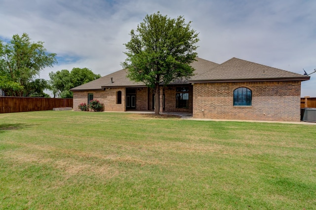 259 County Rd 304, Seminole, TX 79360 - rear view of property with central AC unit, brick siding, and a shingled roof