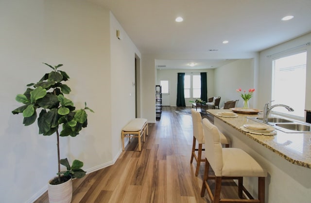 7319 W Pile Ranch Rd, Odessa, TX 79765 - dining space featuring light wood-style flooring, recessed lighting, and baseboards