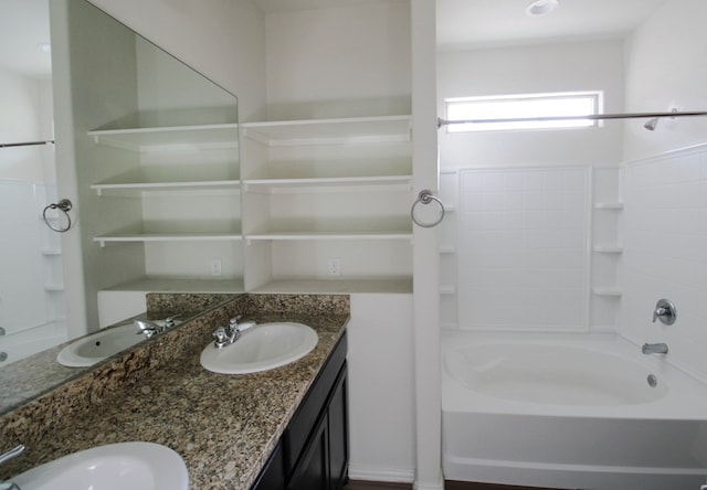 7319 W Pile Ranch Rd, Odessa, TX 79765 - full bathroom with double vanity and washtub / shower combination