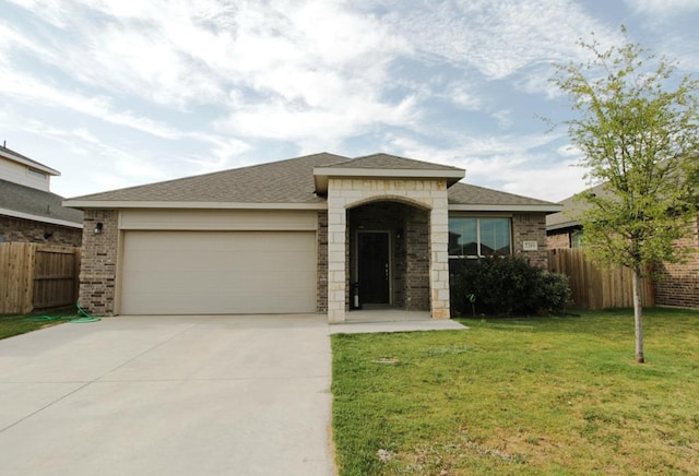 7319 W Pile Ranch Rd, Odessa, TX 79765 - view of front of house featuring an attached garage, driveway, and brick siding