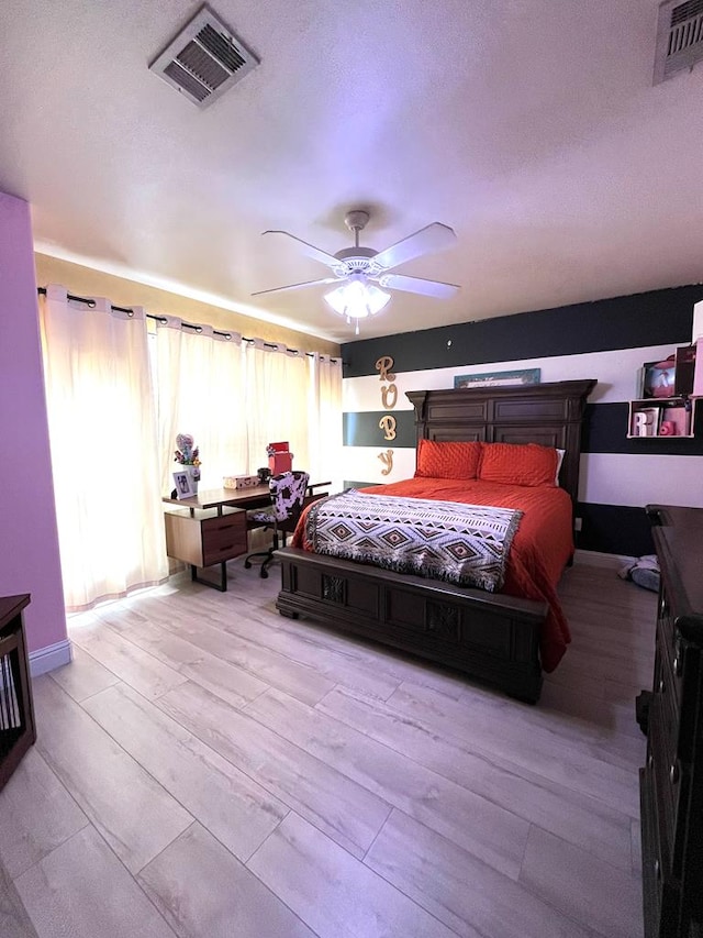 bedroom with wood finished floors and a ceiling fan