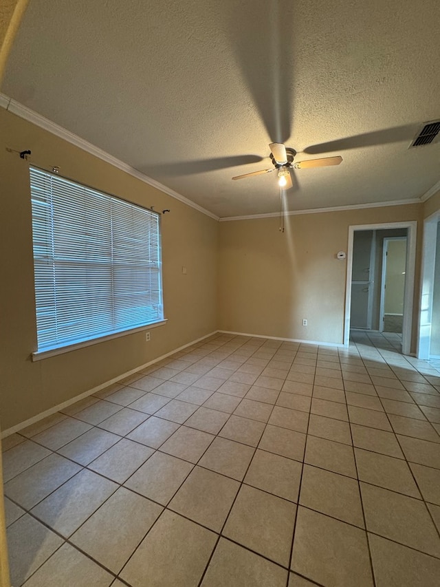 3811 Henderson Ave, Odessa, TX 79762 - spare room with a ceiling fan, crown molding, a textured ceiling, and light tile patterned floors