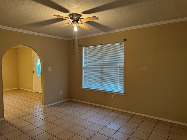 3811 Henderson Ave, Odessa, TX 79762 - empty room with arched walkways, a ceiling fan, crown molding, light tile patterned flooring, and a textured ceiling