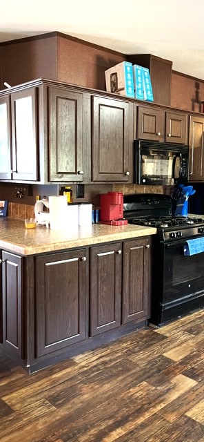1319 S Broughton Ave, Odessa, TX 79761 - kitchen featuring black appliances, dark brown cabinetry, and dark wood-style floors
