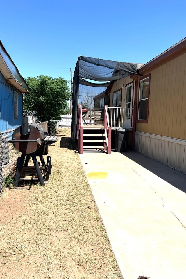 1319 S Broughton Ave, Odessa, TX 79761 - view of patio / terrace with fence and a deck