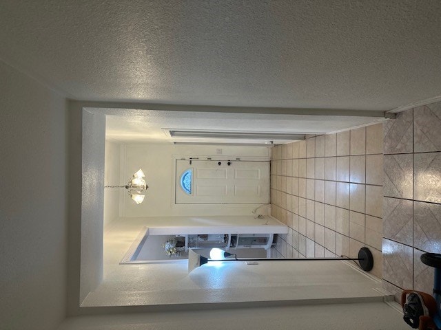 2404 W 10th St, Odessa, TX 79763 - bathroom with a textured ceiling