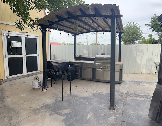 2404 W 10th St, Odessa, TX 79763 - view of patio / terrace with an outdoor kitchen and a sink