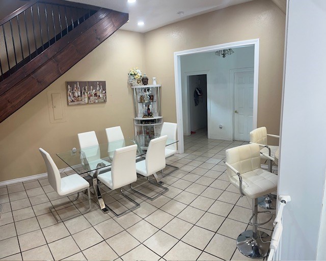2404 W 10th St, Odessa, TX 79763 - dining space with light tile patterned floors and recessed lighting