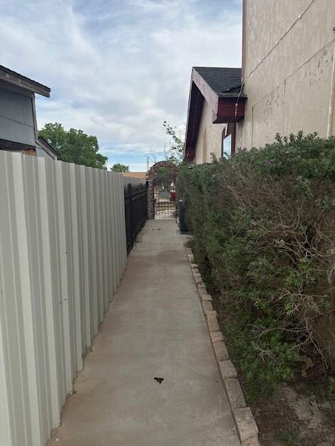 2404 W 10th St, Odessa, TX 79763 - view of side of home featuring a gate