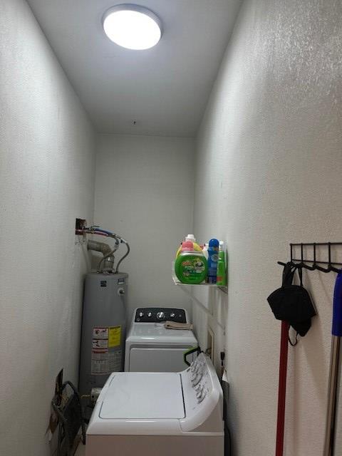 2404 W 10th St, Odessa, TX 79763 - laundry area with independent washer and dryer and water heater