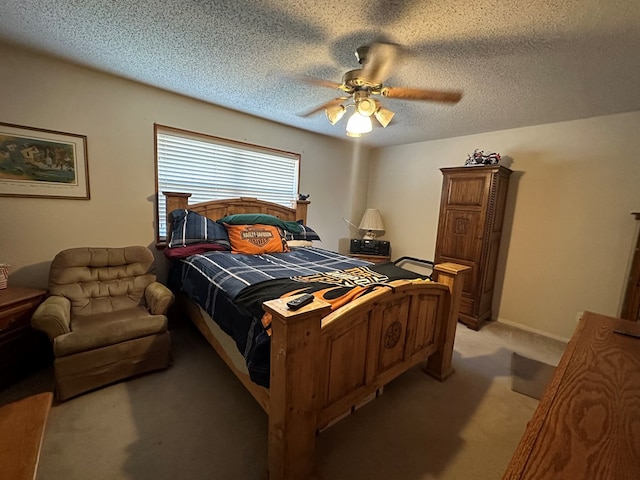 carpeted bedroom with ceiling fan and a textured ceiling