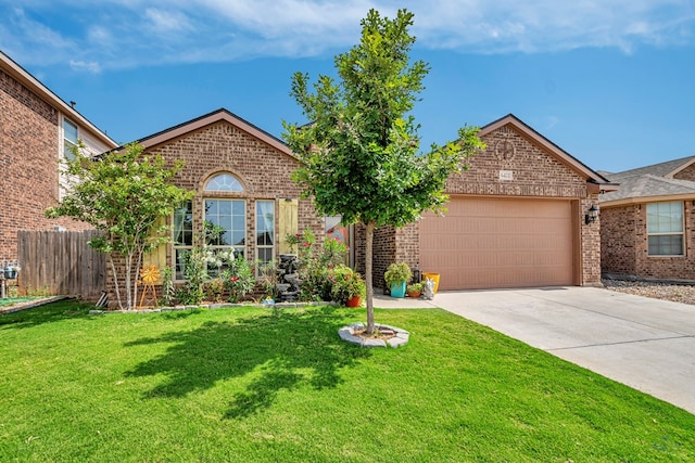 6411 Hall Of Fame, Midland, TX 79706 - view of front of house with brick siding, a garage, and driveway