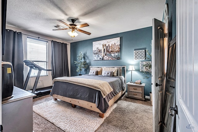 6411 Hall Of Fame, Midland, TX 79706 - bedroom with a textured ceiling, a textured wall, carpet, and a ceiling fan